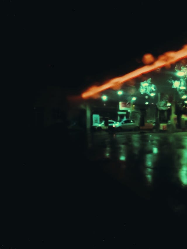An image of a gas station at night.